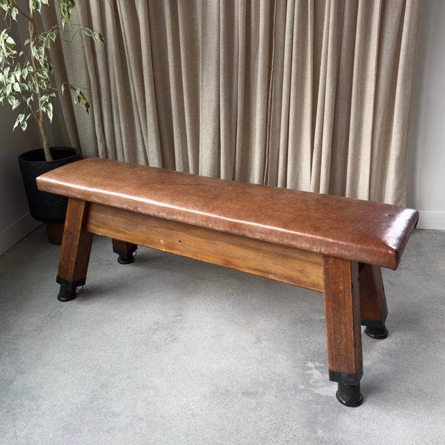 Beautiful long pommel horse with original hardware. The top is covered in leather with beautiful aged patina. These pieces...