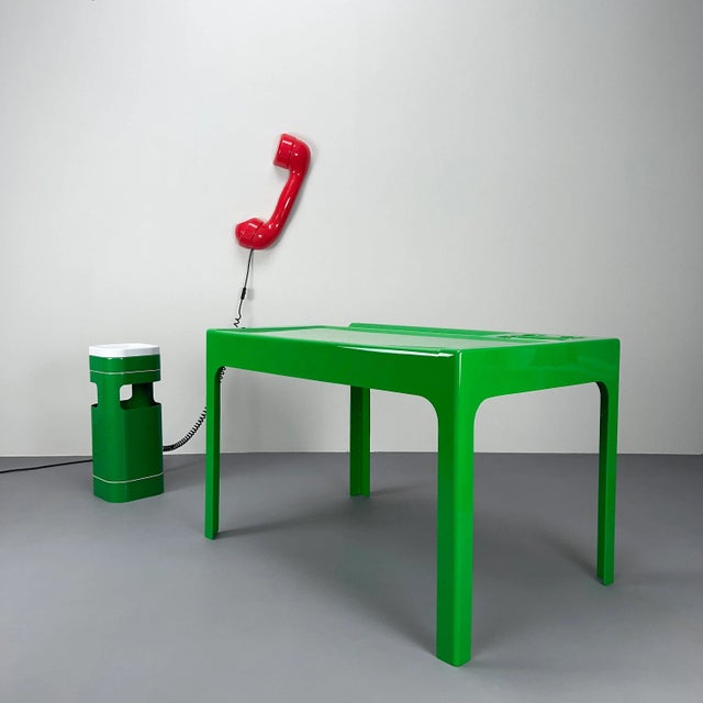 A compact and lightweight desk made of fiberglass and polyester with practical storage compartments and a bookcase....