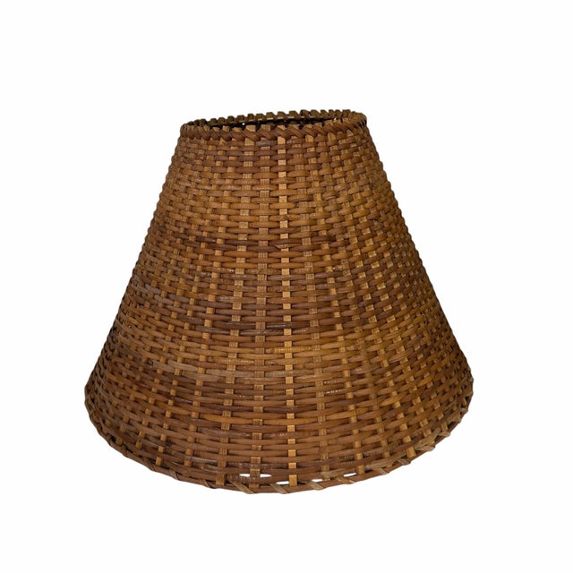 Vintage hand woven rattan lamp shade. Woven on a sturdy gold color frame with multiple supports making it very sturdy....