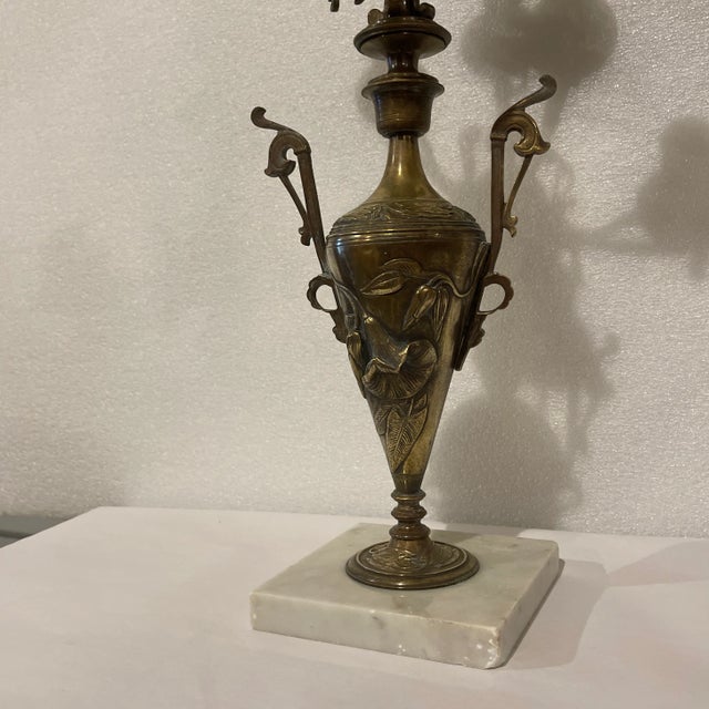 Pair of fine French Bronze six light candelabra In the art nouveau Style on white marble bases. Floral designs On front...