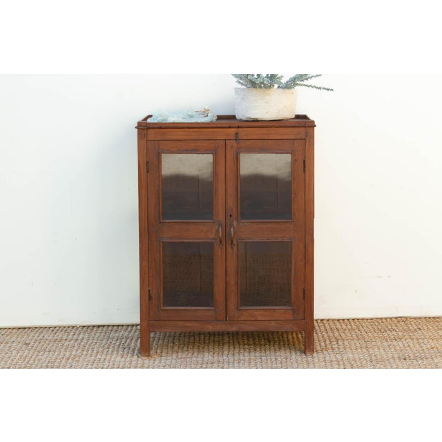 This Vitrine Cabinet is a sophisticated architectural anchor designed for the discerning collector. Standing at 40 inches...