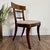 Lovely vintage accent chair with a floral needlepoint design on the upholstered seat. The back features a crest rail with...