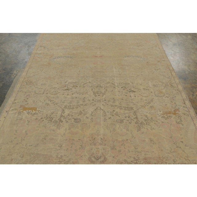 Hand-knotted in natural silk circa 1920-1929, this exquisite 6x10 antique Turkish rug is a masterpiece. It highlights an...