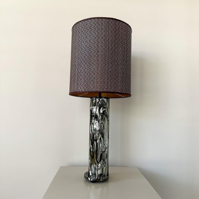 The glass body of this beautiful lamp is cracked and glued, it is not visible during use and is not disturbing. The...