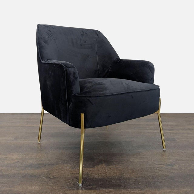 This stylish lounge chair from New Pacific Direct features a soft black velvet upholstery and sleek gold metal legs. The...