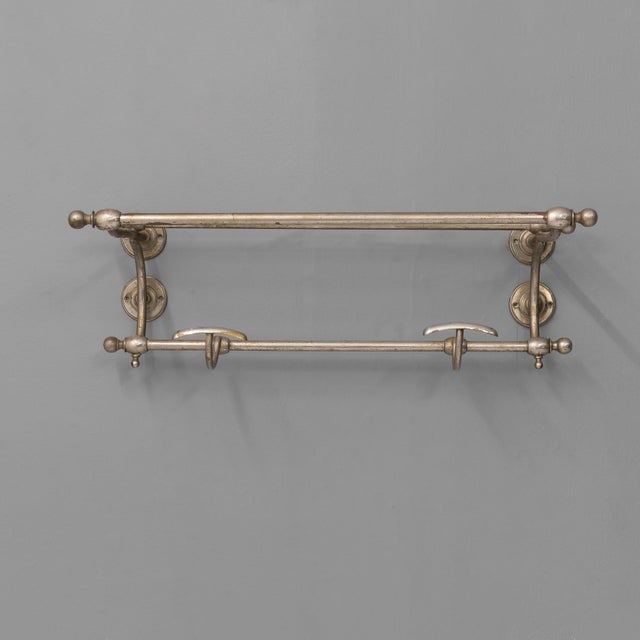 Small size chrome luggage rack with two fixed coat hooks. In aged condition. U.k circa 1900. h 21cm x w 59cm x d 28cm