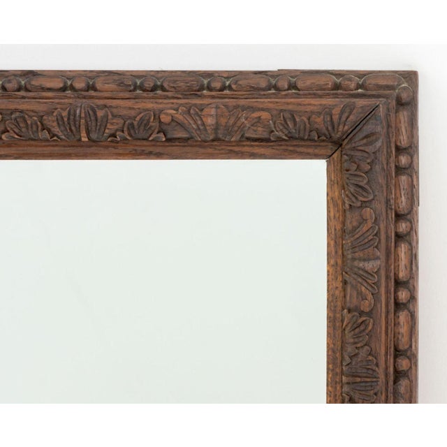 Neoclassical Style Carved Wood Framed Mirror. Mirror plate 17.75" H x 19.75" W; frame: 21.5" H x 23.5" W x 1.25" D....