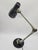 An original, heavy desk lamp with a distinctly industrial character, designed in the Mid-Century Modern style. The...