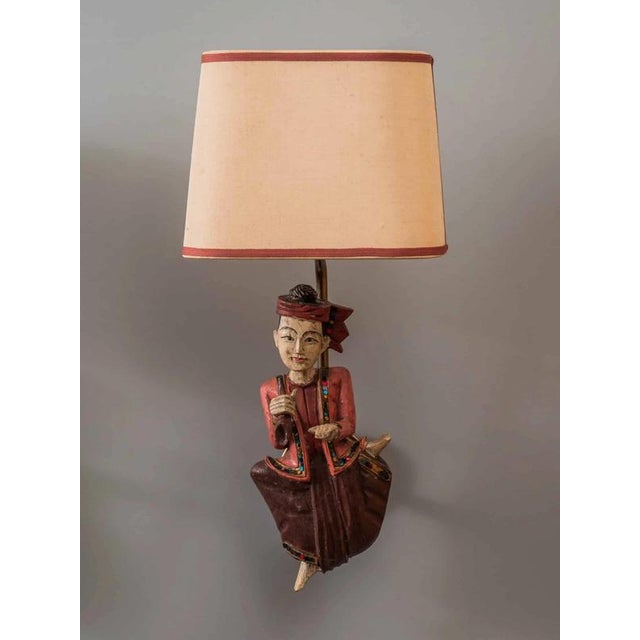 Bring the beauty of your home to life with our unique 1950s Indian wall lamps carved as musicians. These exceptional lamps...