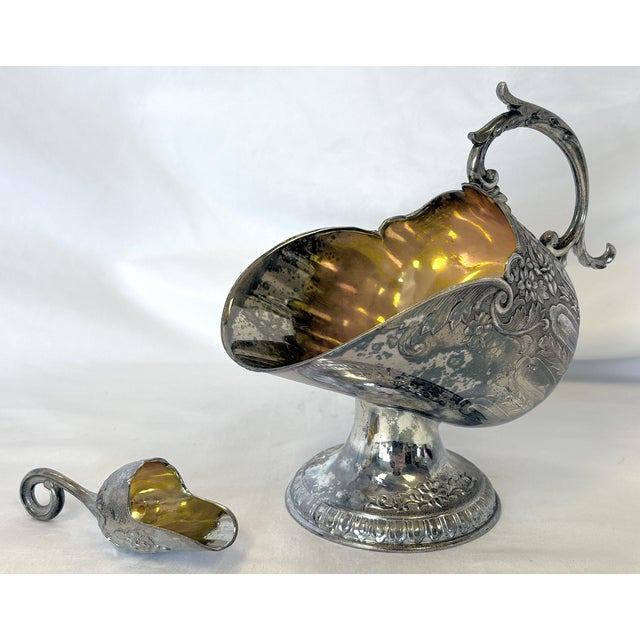Fantastic antique Victorian style salt cellar with scoop from the 1900's. It is made of silverplate and marked 'Japan' on...