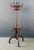 An elegant bentwood standing coat rack by Thonet, showcasing the firm’s mastery of steam-bent beechwood construction. The...
