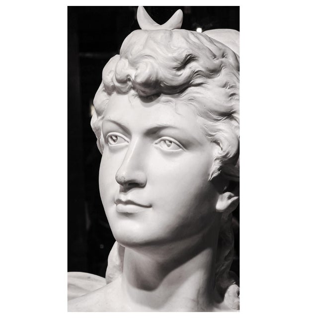 A superb Carrara marble bust depicting Diana the Huntress, goddess of nature and the moon, recognizable by her crescent-...