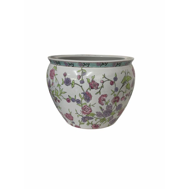 Vintage chinoiserie fishbowl planter. Purple and pink floral print outside either koi print interior. Measures 13”...