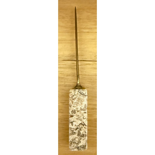 Vintage Brass Letter Opener with Marble Handle Measures approximately 8" long. The solid marble handle is 1" wide. Has a...