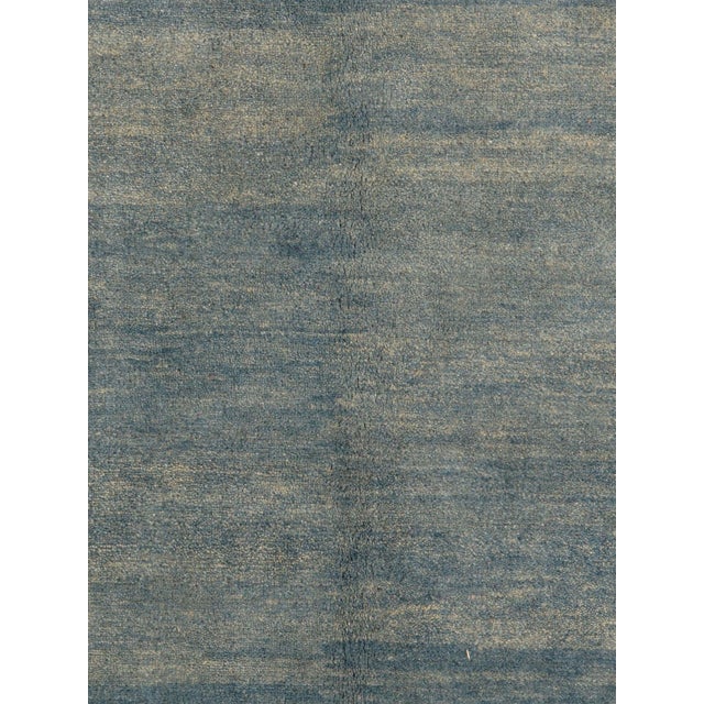 Vintage hand-knotted Persian Lori Gabbeh rug featuring a warm, minimalist field framed by a softly defined border with...