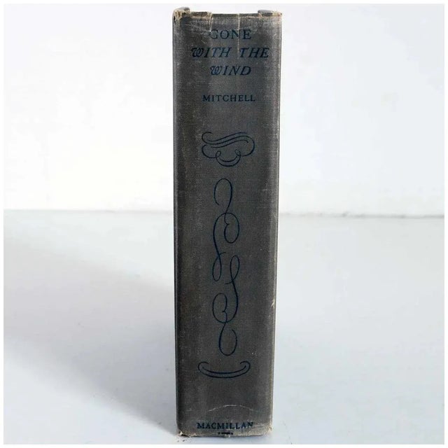 TITLE Gone with the Wind PUBLISHER The Macmillan Company (New York, NY) BINDING Grey cloth bound hardcover. No dust...