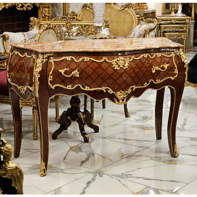 Elevate your interior with this magnificent French Louis XV Commode, a timeless statement piece crafted from solid wood...
