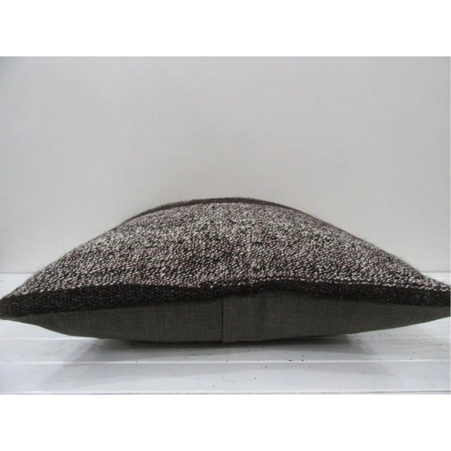 This is a pillow cover made from a vintage kilim rug. The piece was properly washed and ready to use. Pillow inserts not...