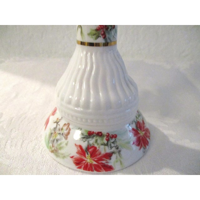 Lovely pair of mid-century white porcelain candle holders featuring a delicate Poinsettia and Holly Berry transferware...
