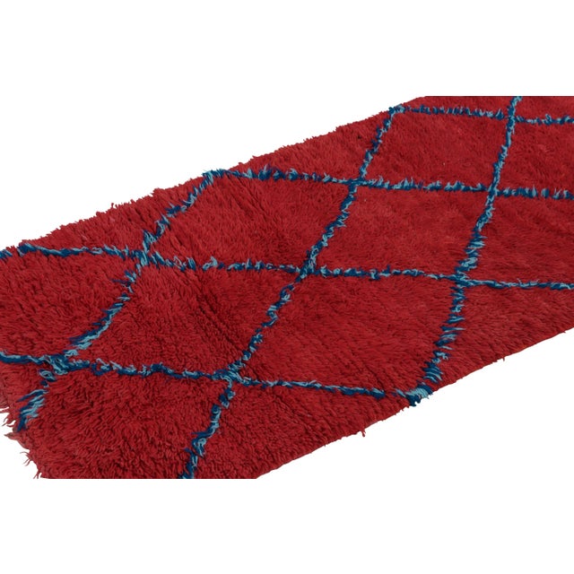 Hand-knotted in wool and originating from Morocco circa 1950-1960, this 3x8 vintage Moroccan rug is an extremely rare...