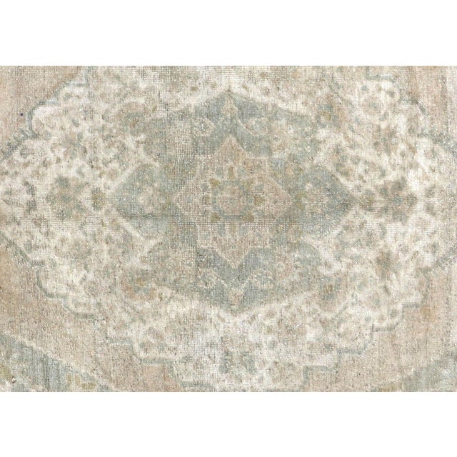 Handwoven wool-on-wool Oushak rug from vintage Turkey, measuring 6'4" x 10'8". Originating from the storied weaving...