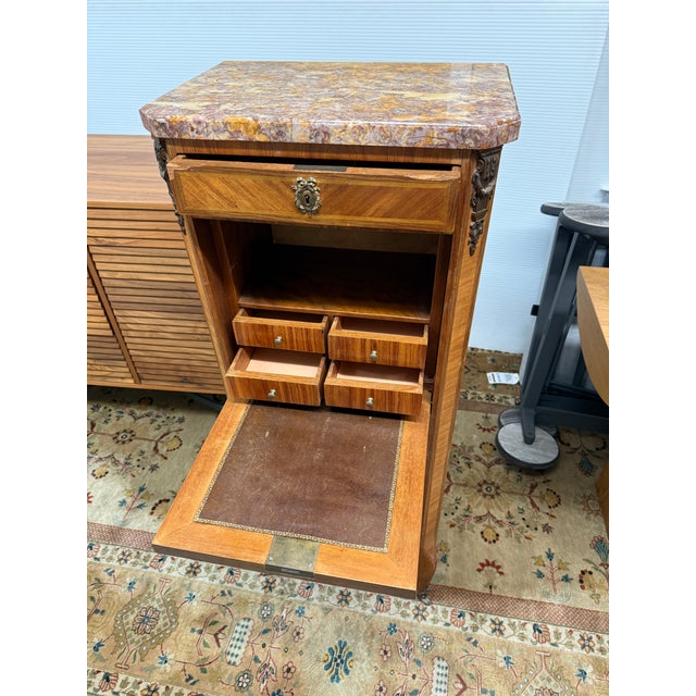 Design Plus Gallery presents a 19th Century Escritoire with Marquetry and Marble that is in the Louis XVI Style. This...
