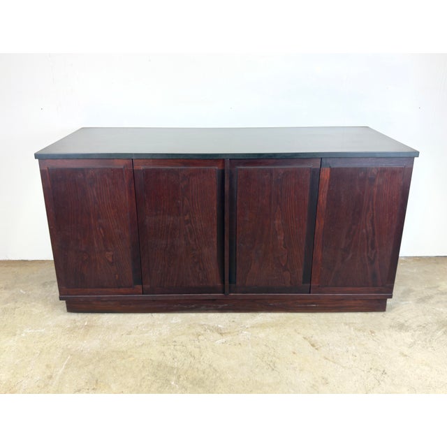 A Mid-Century Modern walnut and slate cabinet designed by Jack Cartwright for Founders Furniture circa 1960’s. Includes 2...