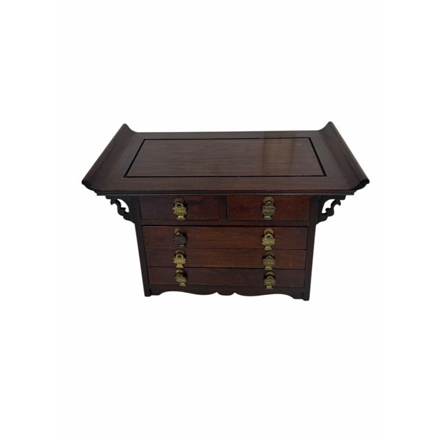Vintage rosewood chinoiserie jewelry box. Design: It features a traditional Asian-inspired aesthetic, specifically hand-...