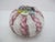 Festive Italian Murano art glass Millefiori paperweight. Dome shaped featuring twisted white latticino ribbons and pink...