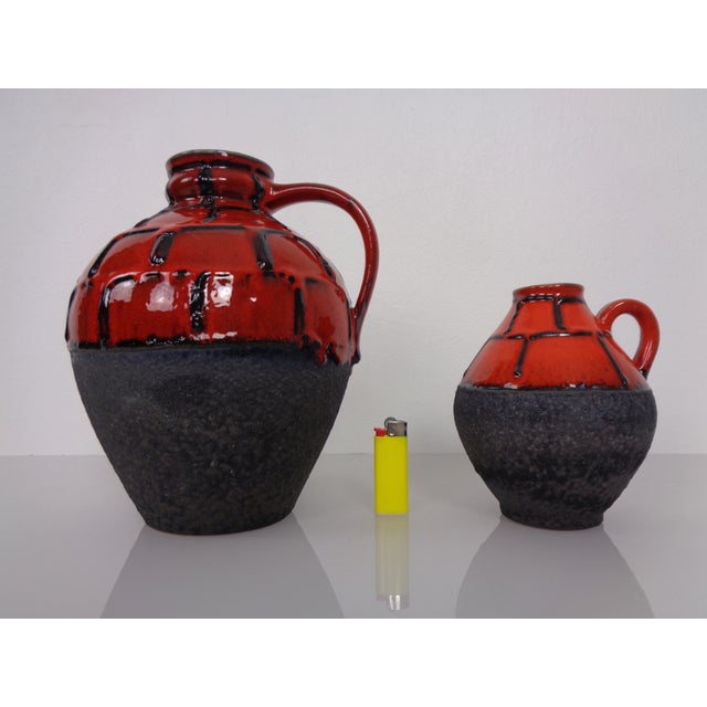 Ceramic handle vases by Heinz Siery for Carstens Tönnieshof. Height 14.5/22 cm. Diameter 12/18 cm. This piece has an...