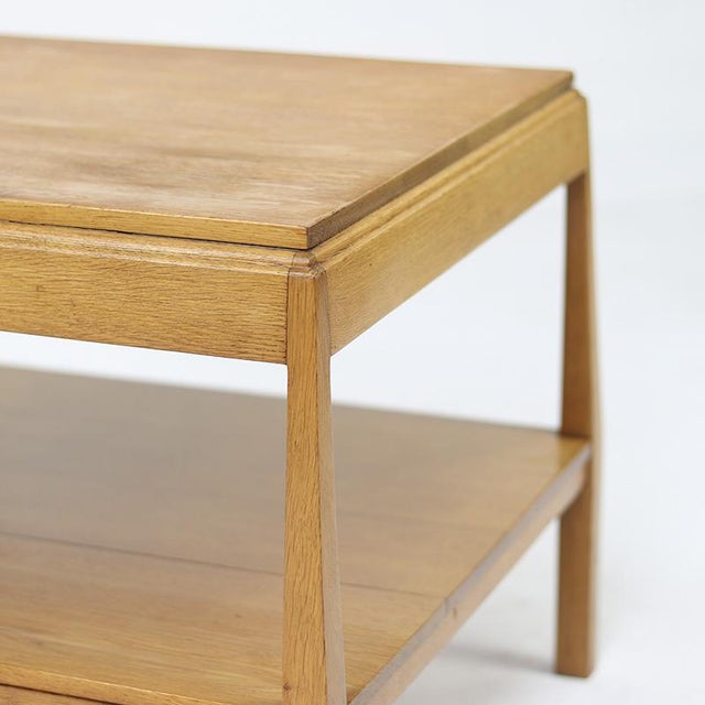 Stylish Art Deco side table or coffee table from the 1930s, made of light oak. The table immediately catches the eye with...