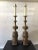 Pair of 1950s James Mont style bronze Asian lamps on metal bases.