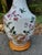 Charming pair of vintage Asian-style porcelain table lamps featuring colorful birds among flowering plum branches and...