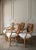 A gorgeous, rare set of four vintage Padma’s Plantation armchairs featuring intricate woven rattan backs and newly updated...