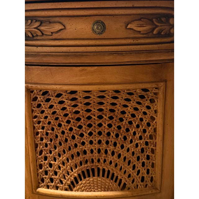 This lovely carved wood and rattan side table is a beautiful piece well preserved and a wonderful conversation piece it...