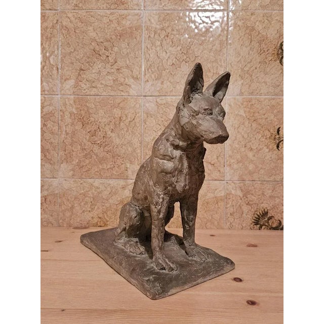 Sculpture in terracotta (patinated) from Art Deco vintage, representing a seated dog. Beautiful modernist modeling Signed,...