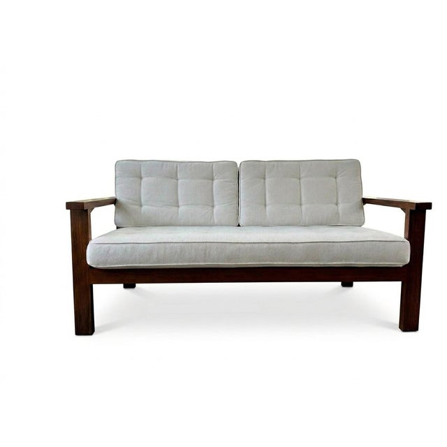 Custom-made loveseat from Brooklyn, NY. Comfortably seats 2 people. Solid oak wood. Cushions included with removable stain...