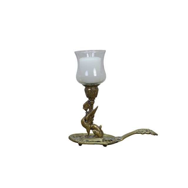 Vintage pierced reticulated brass hurricane chamberstick / candle holder featuring a seated Griffin / Dragon / Sphynx...