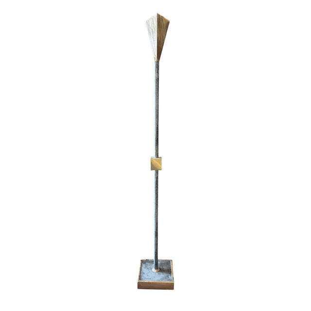 A striking trio of Postmodern brass and copper candlesticks, each varying in height, proportion, and sculptural form....