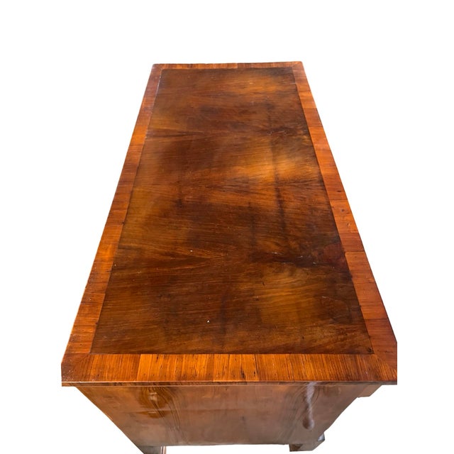 Empire chest of drawers hand-made in the Emilia Romagna region of Italy in the early 1900s using walnut. The chest has...