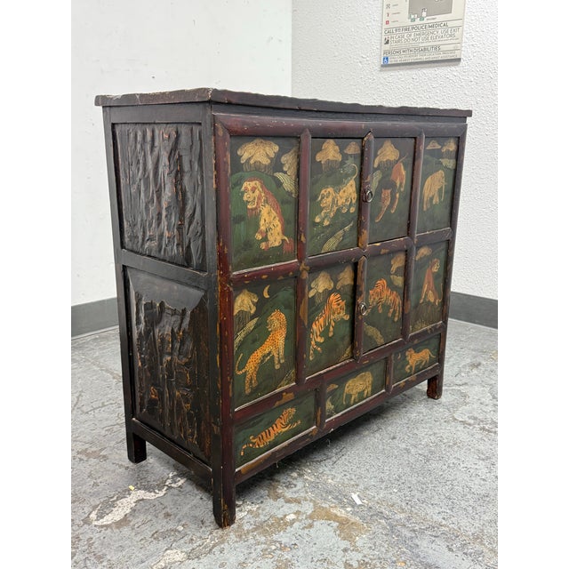 Design Plus Gallery presents an Asian Inspired Cabinet. The case shows an intentionally heavy distressed treatment with a...