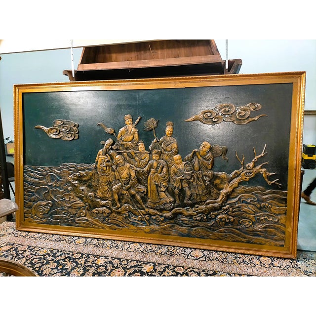 Bas-relief depicting the eight immortals and the "crossing of the seas". wooden panel with lacquered and carved bas-...