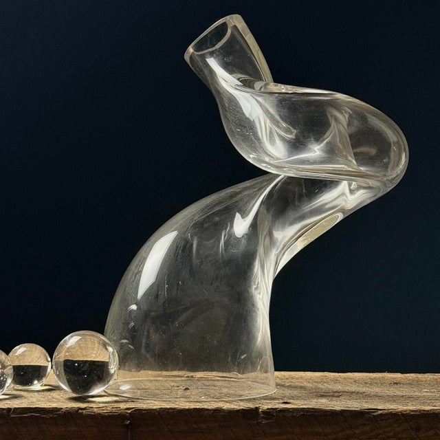 A postmodern biomorphic glass sculpture set, created during the 1980s–90s. Includes two larger sculptural forms accented...