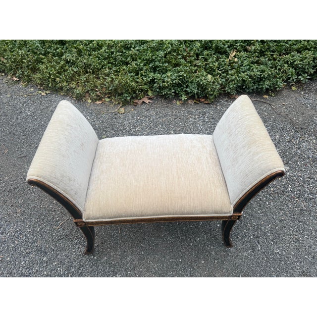 A classic style window bench by Maitland Smith. Newly upholstered in a soft cream silk velvet, the bench has a beautiful...