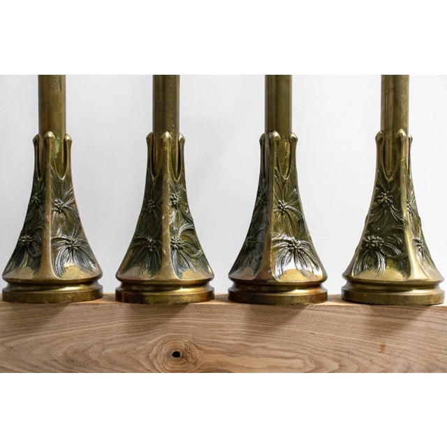 Brass ensemble dating from 1910s. The three pillars without handle measure 16 cm in low diameter, 110 cm high, the tube...