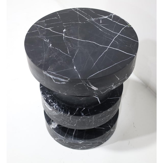 This is easily a side table or a stool. A very heavy carved stool designed by Kelly Wearstler and labeled. It weighs in at...
