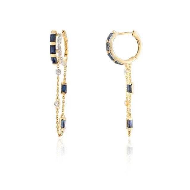 This is part of Chairish’s Fine Jewelry assortment. Unique Blue Sapphire and Diamond Dangling Earrings in 14K Gold to make...