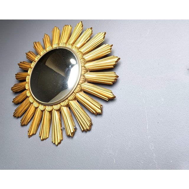 Beautiful resin sunburst mirror with convex mirror glass. The golden mirror is in a good condition. 1960s - made in...