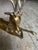 A solid brass reclining reindeer, probably dating from the 70's and possibly by Sarreid of Spain, adorned with diamond-...