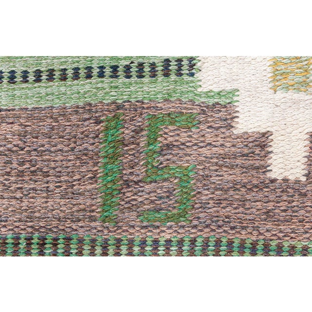 Vintage Swedish Flat Woven Rug Size: 5'2" × 7'9" (157 × 236 cm) This vintage Swedish flat-weave rug by Ingegerd Silow is a...